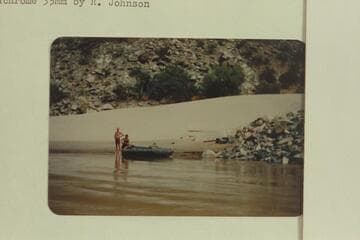 Elgin Pierce and Georgie White waiting at Lava Falls with their neoprene raft