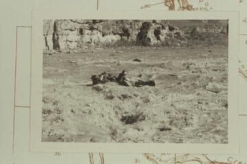George Stewart's 10-man clear of the hole in Coal Creek Rapid and heading downriver bow on and half full of water. The entrance was off to the right about 10 ft. Bud Rusho afterwards ran the proper course with no difficulty