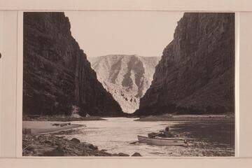 Flying buttresses as seen down river from below Backus Rapid on the left bank.  AK Reynolds moves his boat up the beach to camp