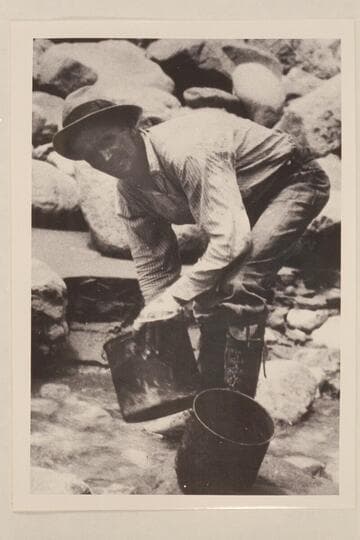 Parley Galloway washed the pots in Kwagunt Creek.  Note the high laced boots