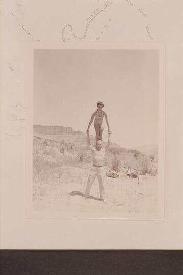 Maradel Marston and Moulty Fulmer put on the act.  Camp at Mile 35 1/2 right bank at mough of Three Fords Canyon.  The background shows the upriver formations