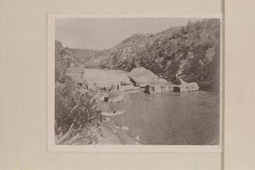 Ashley Falls. A man is standing on a rock near the water in the center of the photo. Extreme low water