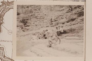 Nevills party camped at the head of the lagoon at the mouth of Supai Creek. Nevills and Kent Frost at right, Al Milotte front center