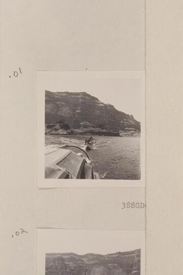 Nevills boats under tow and the crews standing in them for photos.  Approximately the Grand Wash Cliffs on Lake Mead