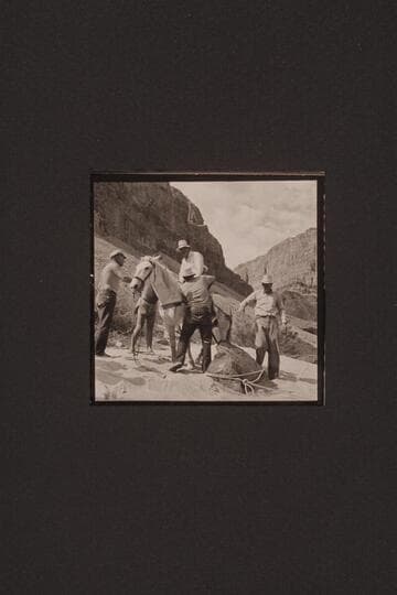 Rod Sanderson, Bill Belknap (back of horse), Chet Bundy and John Riffey prepare Ed Ralph for his ride out of canyon at Whitmore Wash; Mile 188