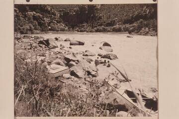 Cooling off in the river after portage of Hells Half Mile. Al Milotte walks up the rocky shore at left. Shirley Marston at edge of river behind Willie Taylor. Loel and Garth Marston are in the water