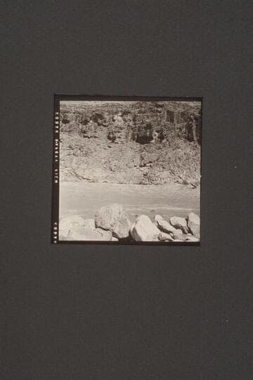 Rod Sanderson puts the "Twin" through Mile 217. Jack Couffer photographs the run