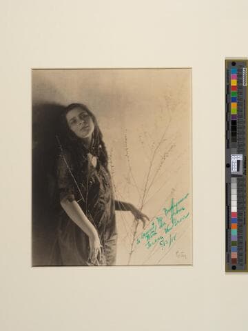 [Terese Van Grove with a branch]