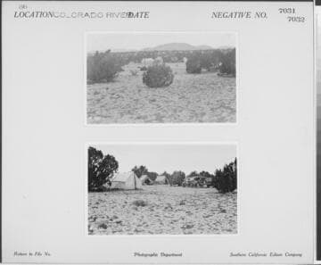 Colorado River - Tent camp with vehicles in desert