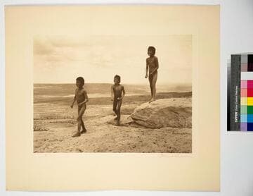 Hopiland. Arizona. Hopi boys playing on the very edge of the mesa where a misstep would mean a fall of several hundred feet to the rocks below