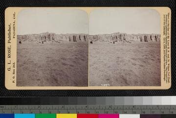 Distant view of Acoma Pueblo, New Mexico, on top of mesa. Mission Church can be seen in center