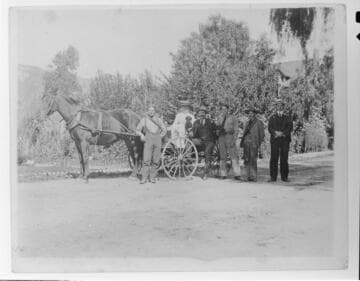 The operating staff of Mill Creek #1 Hydro Plant and the plant superintendent and his wife pose for an informal portrait with a buggy