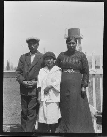 Group portrait of unidentified Native American man, woman and girl