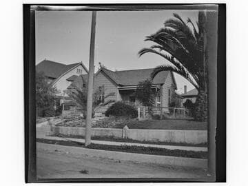 Unidentified house with garden and palm trees