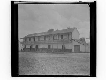 Two-story hotel and "E. Darius & Co. General Merchandise" store, San Juan Capistrano, California