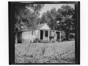 Unidentified house with hammock on porch