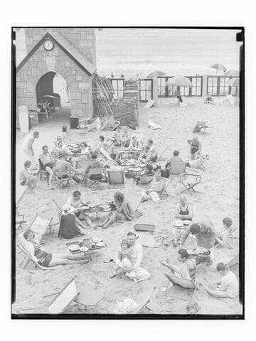 People sitting outdoors at Deauville Club in Santa Monica