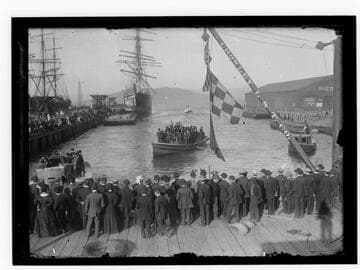 Crowd and boats at pier, Coos Bay, Oregon
