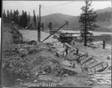 Work crews pouring an eastern "wing wall" extension to Dam #1