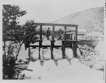 Chief Engineer Charles O. Poole looking at the dam at the intake to Plant Four on Bishop Creek, 1905