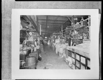 Photo of old market interior with merchants and patrons