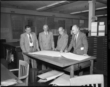 Engineers reviewing plans (with 1 variant)
