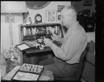 Photographer working with slide collection