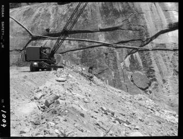 Big Creek - Mammoth Pool - Spreading downstream slope protection material