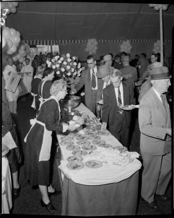 Vistors picking up food at buffet