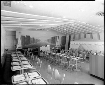 Restaurant (?) with paired individual tables