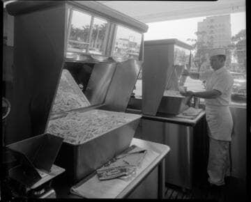 Fry cook working at fast food restaurant