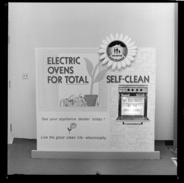 Signs promoting self cleaning electric ovens and electric clothes dryers