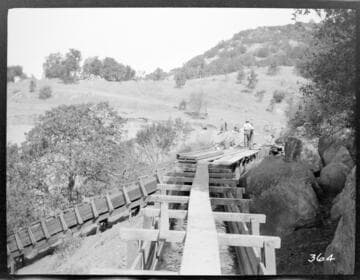A construction crew working on the forebay reservoir of the Tule Plant