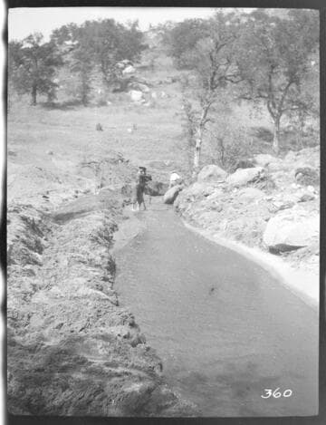 A construction crew working on the nearly completed ditch at Tule Plant
