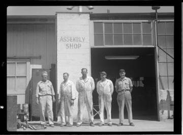 Group of employees standing outside Assembly Shop