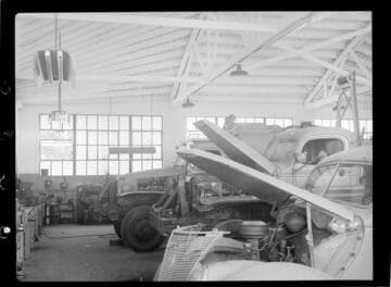 Automobiles being repaired at CEP auto repair garage