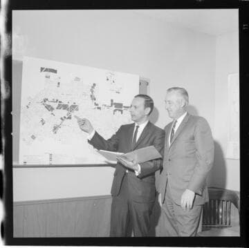 Men reviewing zoning maps for the City of West Covina