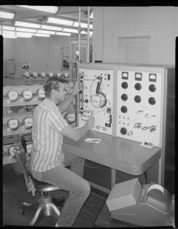 Technician testing electric meter