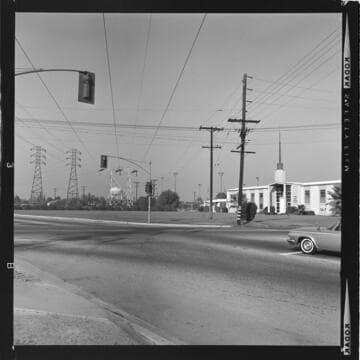 Transmission line corridor running through Disneyland parking lot and office shots