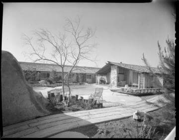 Newly constructed condominium complex with two-story apartments on perimeter and single-story construction for the interior units