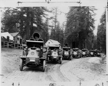 These Mack Bulldogs are at the foot of the Kaiser Pass Road at Huntington Lake, laden with pipe for the Mono-Bear Siphon near Florence Lake