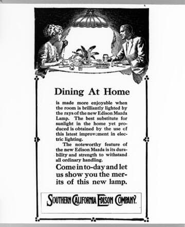 A poster advertising the new Edison Mazda Lamp, showing a couple dining at home