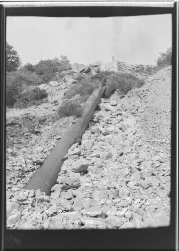 Sierra pipeline [penstock] showing pipe below tunnel in collapsed condition