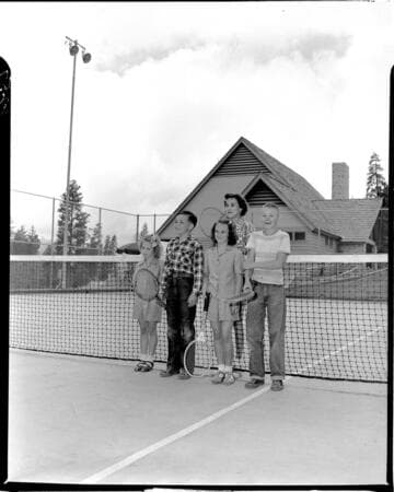 Group shot of four kids and instructor on Big Creek tennis court