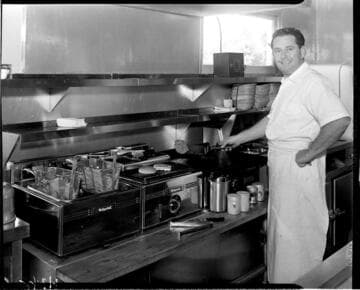 Chef cooking burgers