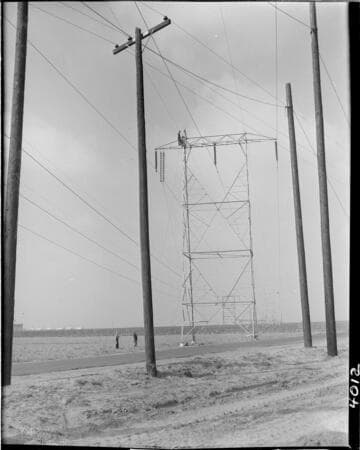 Stringing conductor on transmission towers