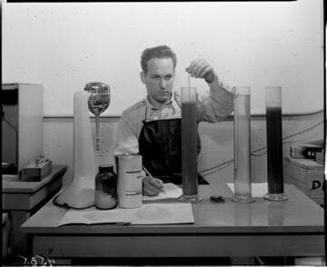 Man mixing material for tests