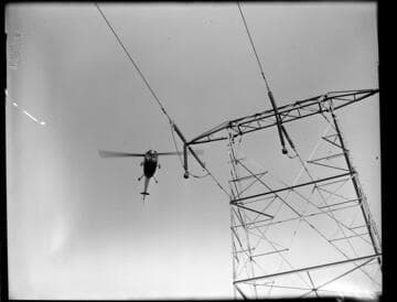 Helicopter patrolling Transmission Line