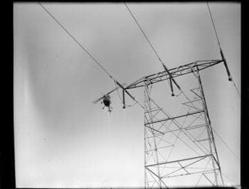 Helicopter patrolling Transmission Line