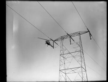 Helicopter patrolling Transmission Line